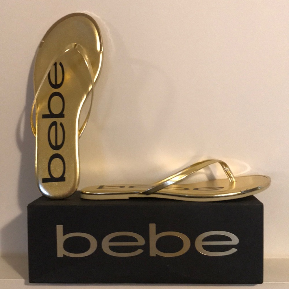 Gold bebe flip flops